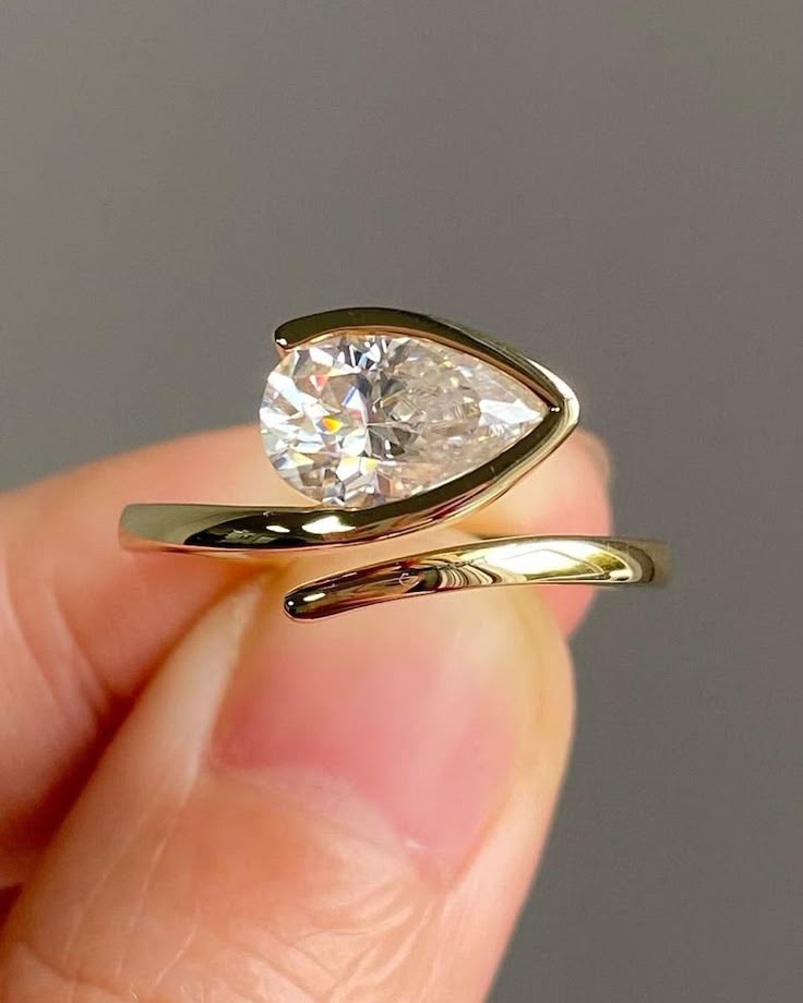 a person holding a diamond in their hand