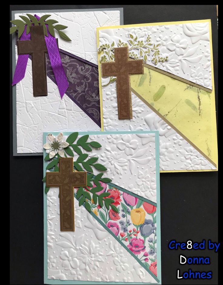 three cards with cross and flowers on them, one has purple ribbon around the edges