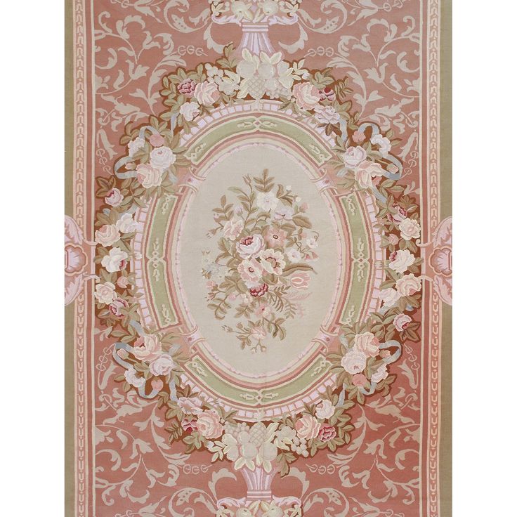 a pink rug with flowers and leaves on it