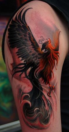 a man with a tattoo on his arm has a red and black bird on it