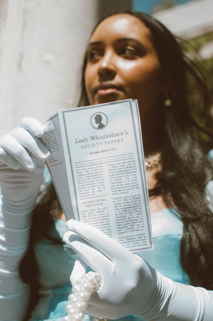 a woman in white gloves holding up a newspaper