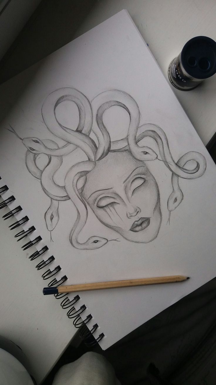 a pencil drawing of a woman's face with an octopus on her head and eyes