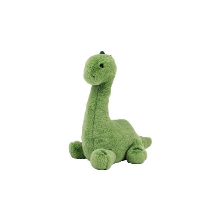 a green stuffed animal sitting on top of a white surface