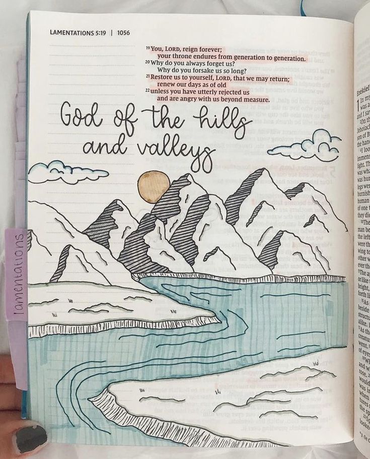 an open book with the words god of the hills and valleys written in black ink