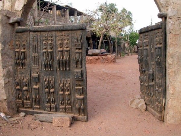 an old gate with carvings on it