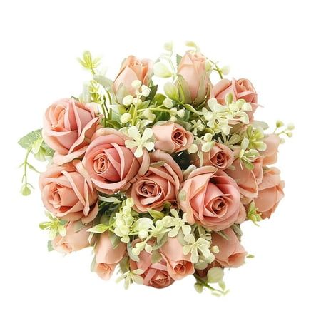 a bouquet of pink roses and white flowers