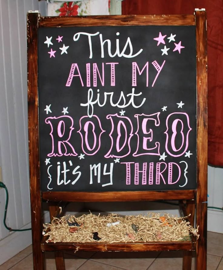 a sign that says, this is my first rodeo it's my third in pink