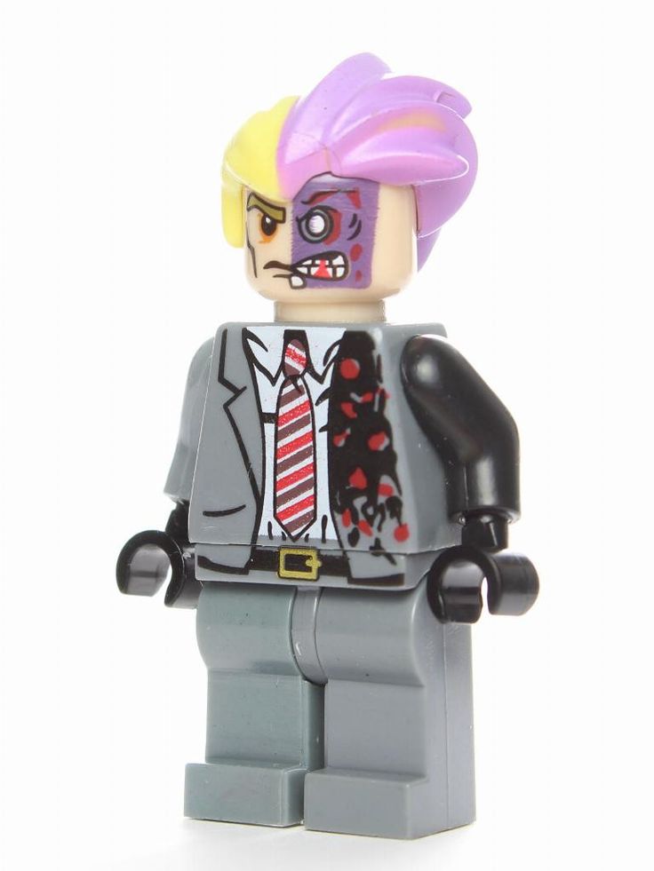 a lego man with purple hair wearing a suit and tie, standing in front of a white background