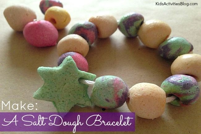 a bracelet made out of doughnuts and star shaped beads with the words make a salt dough bracelet