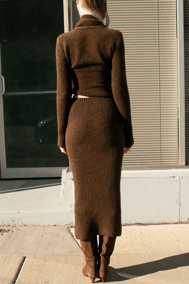 Long, fitted tube skirt in a soft ribbed knit. Covered elastic waistband. Fabric is 34% recycled polyamide 32% mulesing free merino wool 32% alpaca 2% elastane. Ella is 6' tall, 35" bust, 26" waist, 36" hip, and is wearing a size S. Knitted Skirt Aesthetic, Brown Knitted Skirt Outfit, Knitwear Skirt Outfit, Long Wool Skirt Outfit, Knit Skirt Outfit Winter, Long Skirts Winter, Knitted Skirt Outfit, Apostolic Outfit Ideas, Brown Knit Skirt