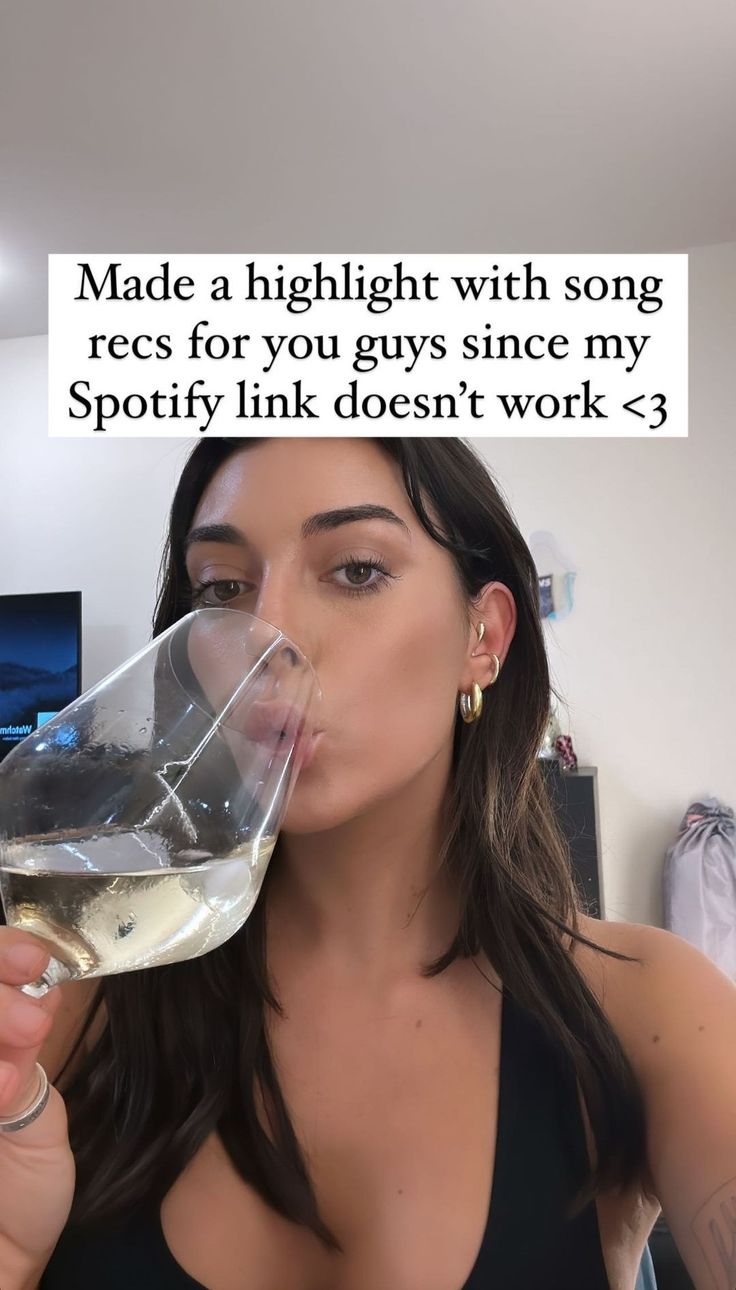 a woman drinking from a wine glass with the caption made a highlight with song recs for you guys since my spoty link doesn't work >