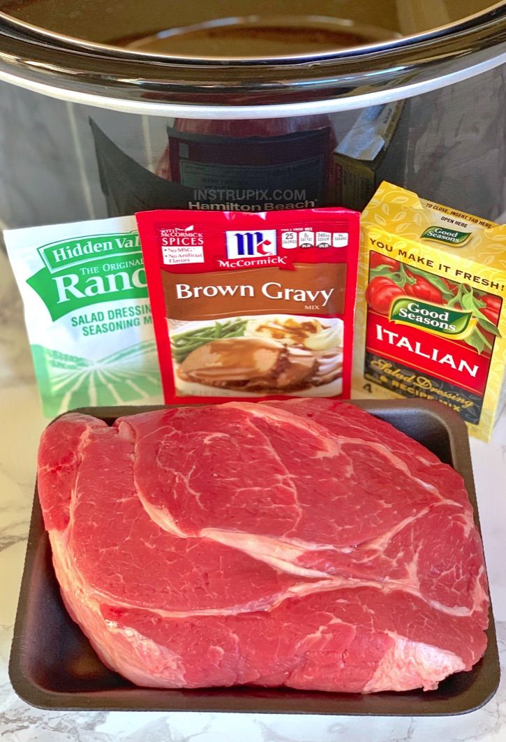 raw meat and spices on a tray in front of an instant pressure cooker with the ingredients