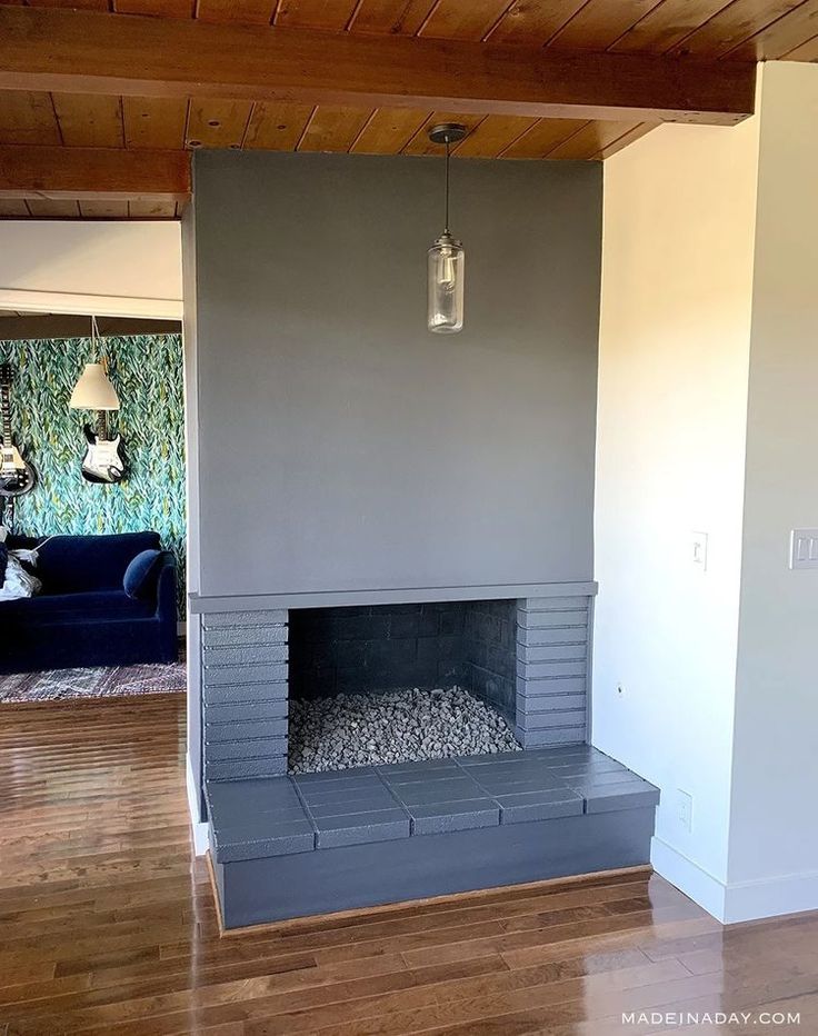 an empty living room with a fireplace in it