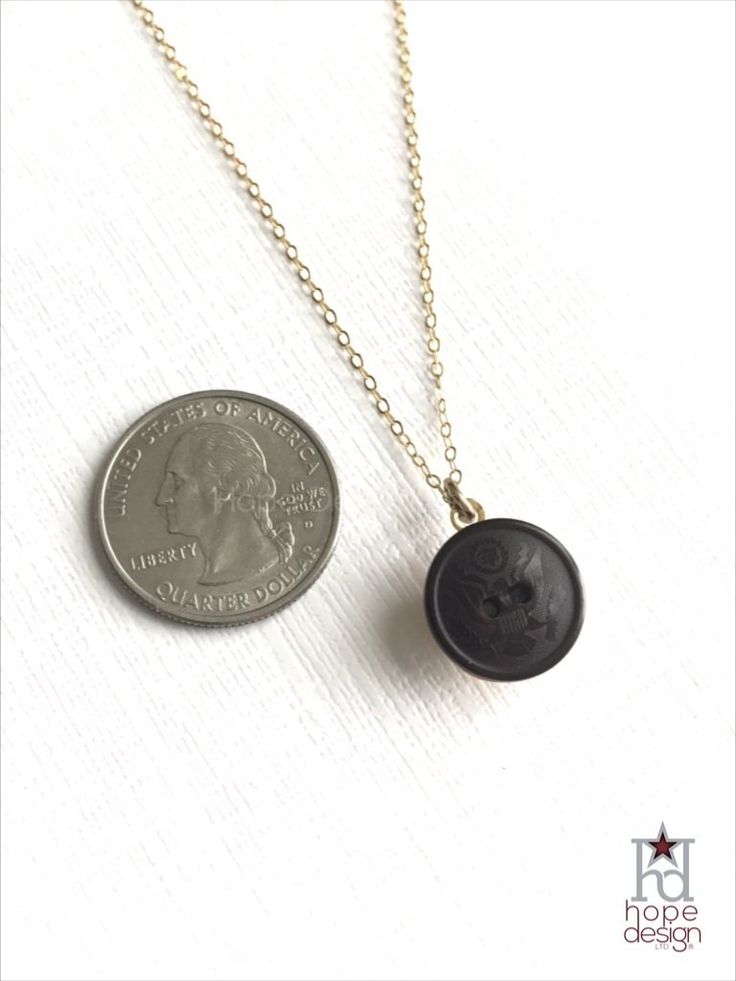 This military button necklace bears a vintage 1943-1944 WWII US Army uniform button centerpiece. This gold-tone setting is strung on a 14K Gold-Filled, 18-inch chain with c-clasp. This military jewelry makes the perfect military gift for the soldier, their wife, mom, or girlfriend. This piece was hand-crafted by a military spouse at Hope Design Ltd., reinventing military heraldry in a modern, fashionable way.