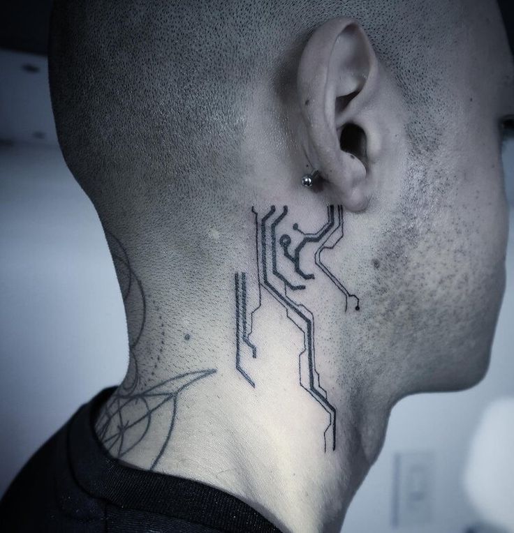 a man with a tattoo on his neck