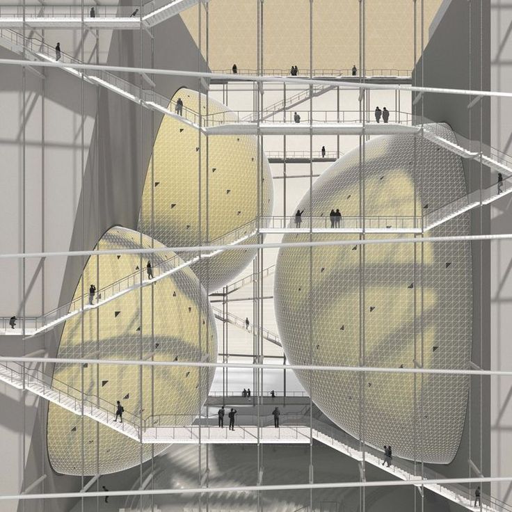 an overhead view of some yellow balls in a building with people standing on the floor