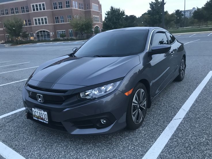 a gray car parked in a parking lot