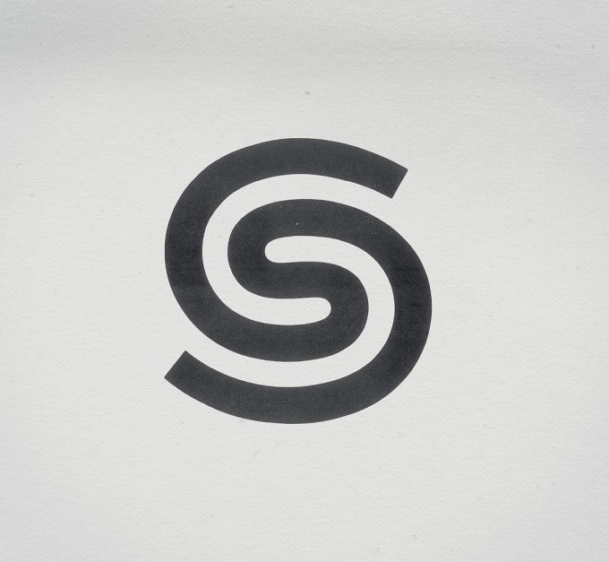 the letter s is inscribed in black on a white background