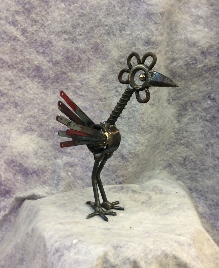 a statue of a bird made out of scissors