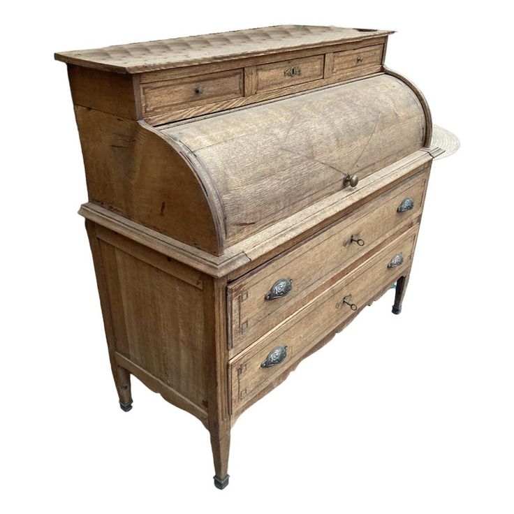 an old fashioned wooden desk with drawers