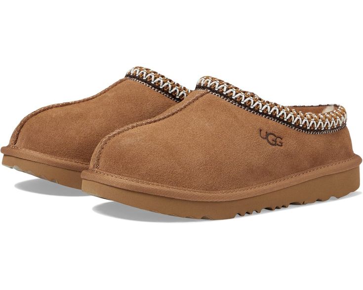 NEW KIDS UGG TASMAN SLIPPER SUEDE COLOR: CHESTNUT SKU # 1019066K SIZES PLEASE NOTE THE SIZES LISTED IT'S US SIZES 3 KIDS - 4.5 WOMEN US 4 KIDS - 5.5 WOMEN US 5 KIDS - 6.5 WOMEN US 6 KIDS - 7.5 WOMEN US ALL OUR SHOES ARE 100% AUTHENTIC IN THE ORIGINAL BOX WITH THE TAG OR MONEY BACK DESCRIPTION This product was made in a factory that supports women in the UGG supply chain with the help of HERproject, a collaborative initiative that creates partnerships with brands like UGG to empower and educate women in the workplace. Be ready for a sleepover with the UGG® Kids Tasman II slipper! Suede upper. Tasman braid collar. Easy slip-on design. UGGpure™ wool lining. UGGpure™ wool footbed. Treadlite by UGG™ synthetic outsole. Imported. Returns Returns are only accepted for unworn shoes. In the event of Ugg Slippers Kids, Uggs For Kids, Trendy Uggs, Kids Ugg Slippers, Tasman Uggs, Matching Slippers, Brown Uggs, Cute Uggs, Women In The Workplace