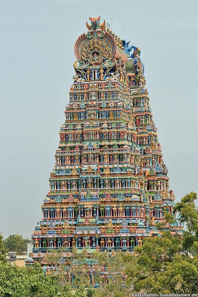 a very tall colorful building with lots of decorations on it's face and sides