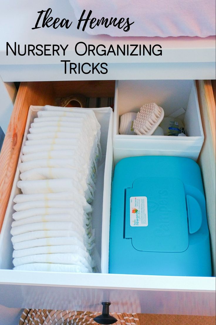 an open drawer filled with baby items and the words ikea hennes nursery organizing tricks