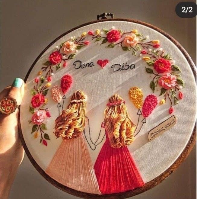 two women with braids and flowers are holding up a cross stitch embroidery kit that says dena dise