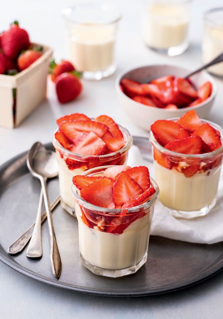 three desserts on a white plate with silverware