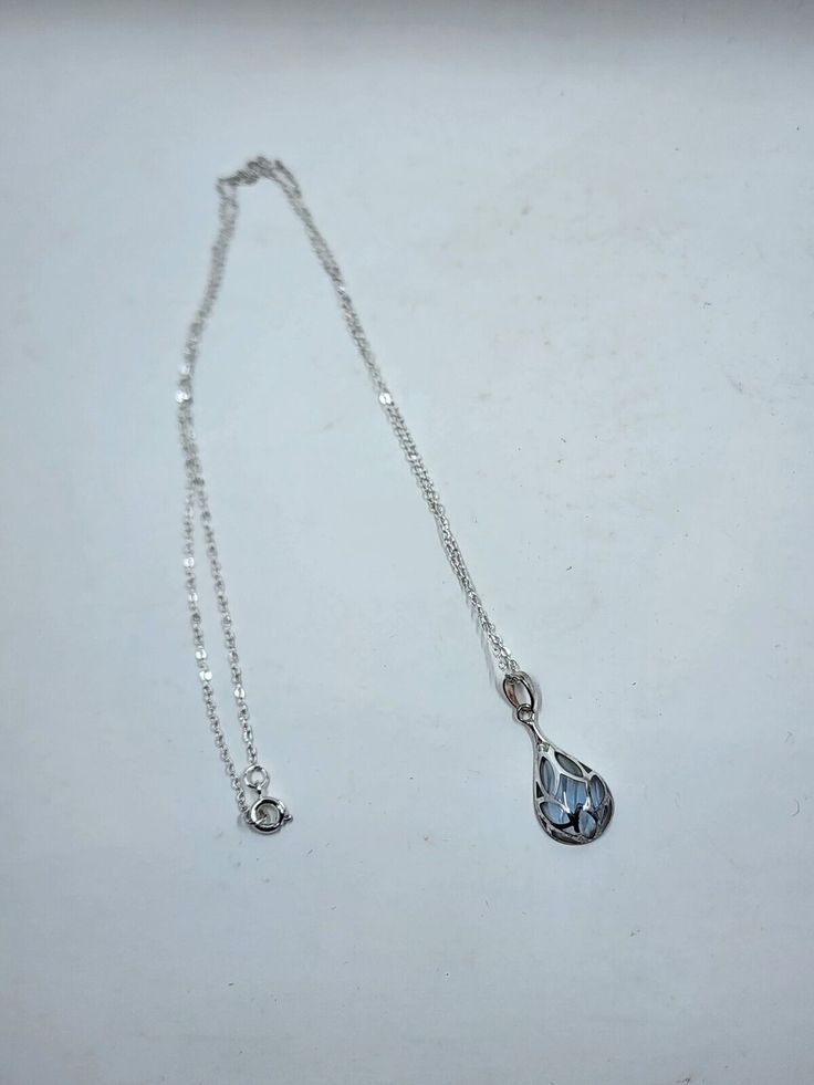 Brand new in-box Avon sterling silver colored teardrop pendant with silvertone necklace blue. Shipping: All orders are shipped within 1 business day after receiving payment (excluding U.S. holidays and weekends) All orders are shipped from Port Saint Lucie, Florida If purchasing more than one item shipping will be combined All items will be shipped in a generic jewelry box International Buyers: Import duties, taxes, and chargers are not included in the item price or shipping charges; these charg Blue Silver Jewelry, Blue Sterling Silver Pear-shaped Necklace, Blue Sterling Silver Drop Necklace For Gift, Blue Sterling Silver Drop Necklace As A Gift, Blue Teardrop Pendant Necklace In Sterling Silver, Blue Sterling Silver Teardrop Pendant Necklace, Blue Teardrop Drop Necklace For Formal Occasions, Formal Blue Teardrop Drop Necklace, Silver Teardrop Birthstone Drop Necklace