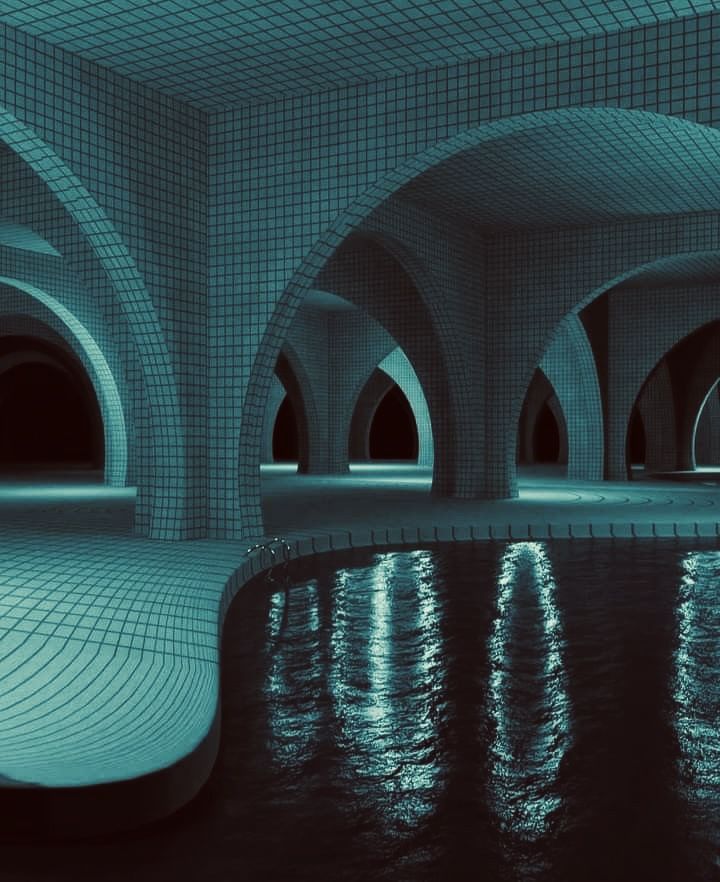 an underground swimming pool with lights reflecting in the water and arches on either side at night