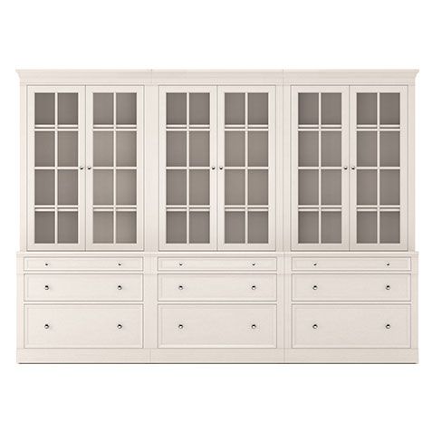 a white cabinet with glass doors and drawers on the bottom, in front of a white background