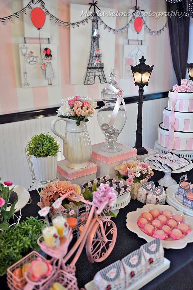 a table topped with lots of cakes and desserts