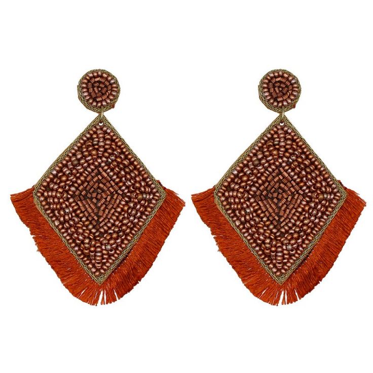 two pairs of orange and brown earrings with fringes on top of each earring