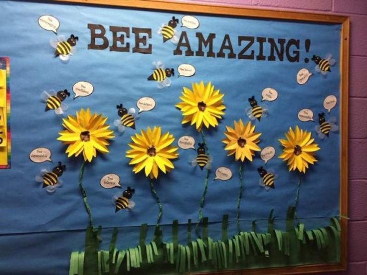 a bulletin board with flowers and bees on it