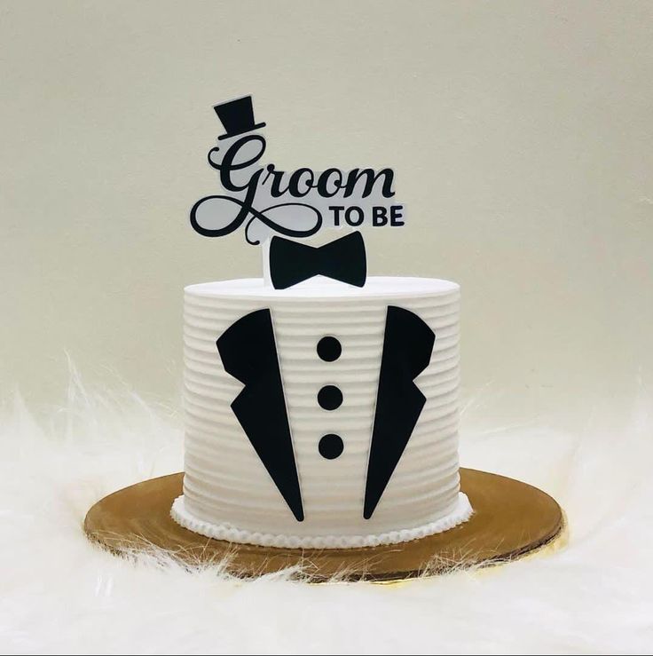 a groom to be cake topper with a tuxedo on it