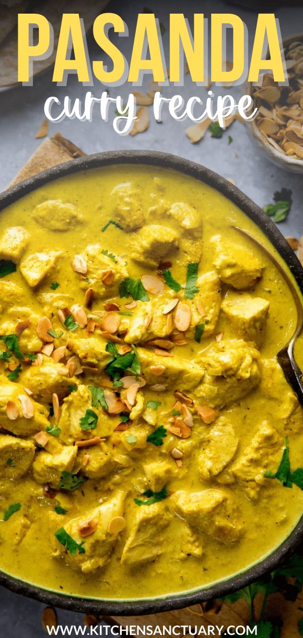 a pan filled with chicken curry and cashews