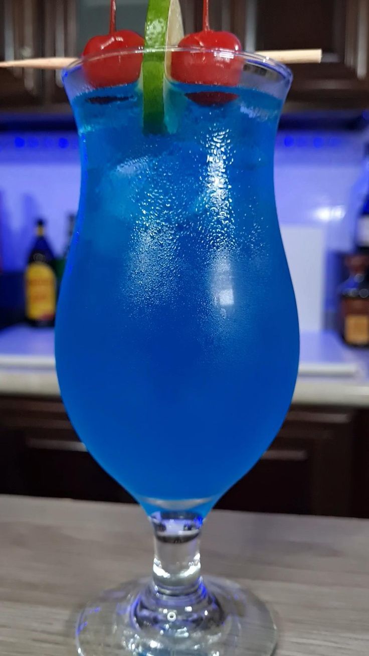 a blue drink sitting on top of a wooden table