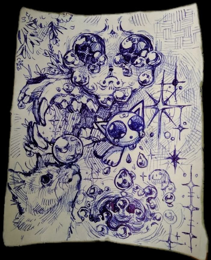 a blue and white pillow with drawings on it