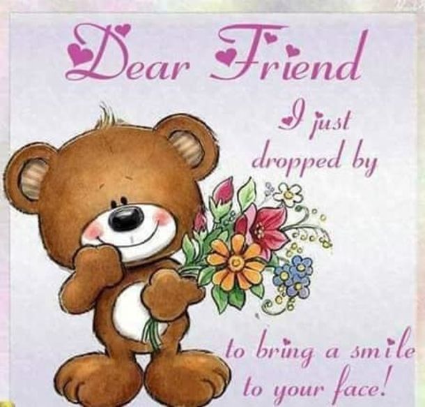 a brown teddy bear holding a bouquet of flowers with the words dear friend just dropped by to bring a smile to your face