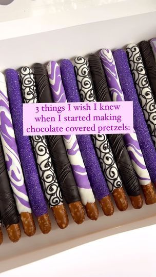 purple and white chocolate covered pretzels are arranged in a row on top of each other