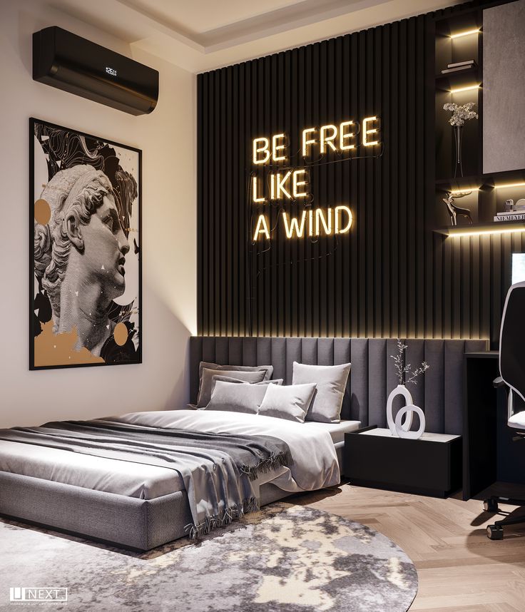 a bedroom with a bed, desk and chair in front of a wall that says be free like a wind