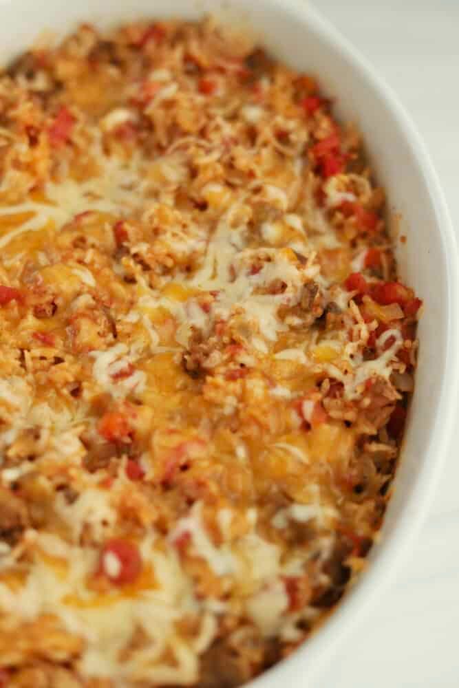 a casserole dish with meat and cheese in it