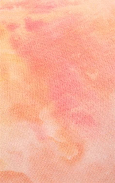 an orange and pink watercolor background