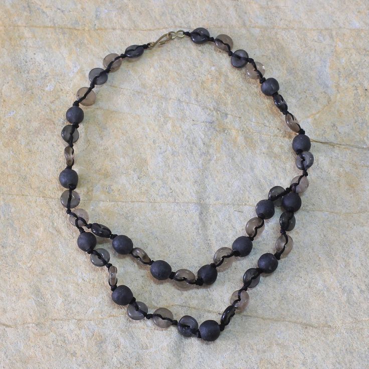 Beads in taupe gray and black combine in a beautiful necklace by Nonyem Abena Ibeneme. The beads are crafted of recycled glass and knotted by hand to flow into two strands in front. This is a happy design the Nigerian artisan says. Happy Design, Beautiful Necklace, Recycled Glass, Bead Necklace, Beautiful Necklaces, Mens Bracelet, Chic Style, Chain Necklace, Premium Quality