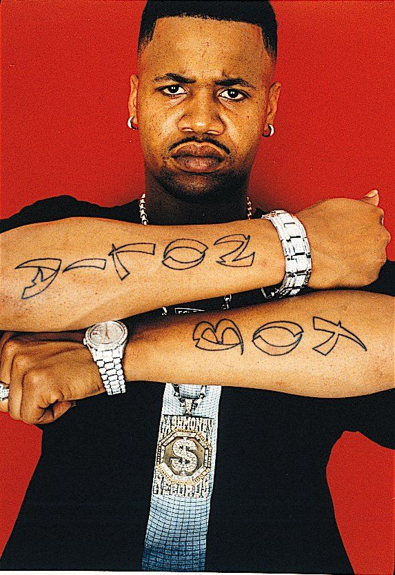 a man with two tattoos on his arms