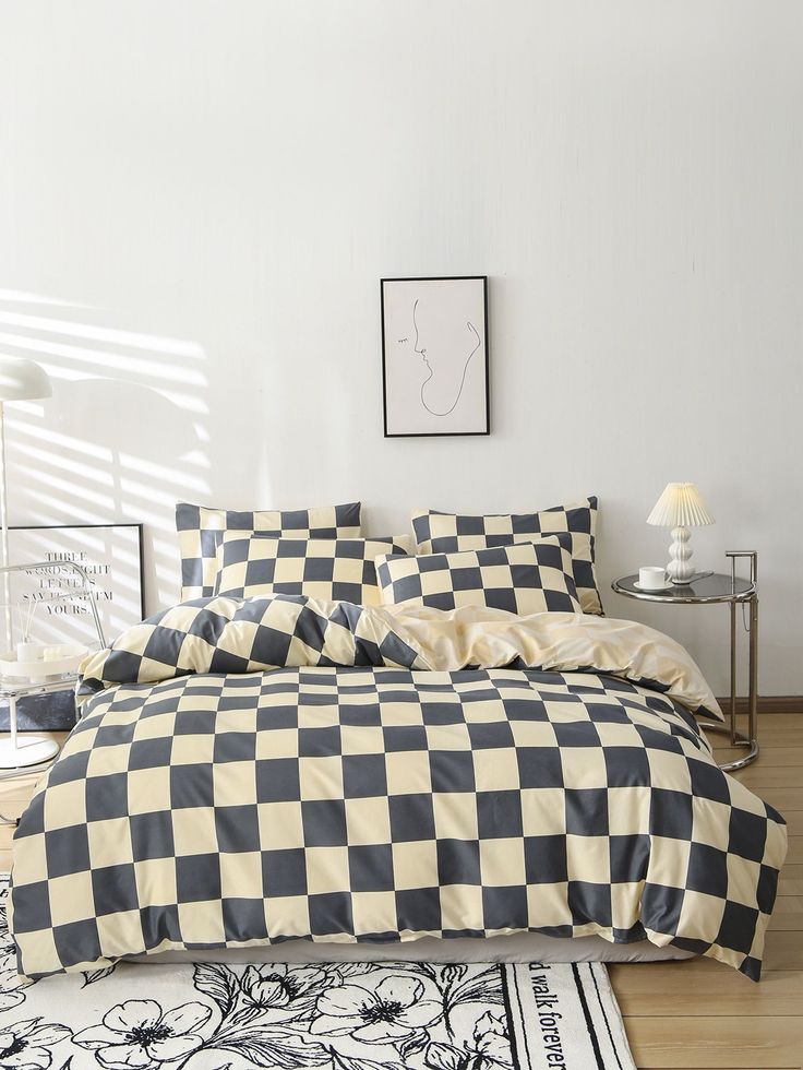 a black and white checkered comforter on a bed