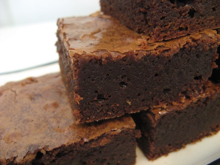 brownies stacked on top of each other on a plate