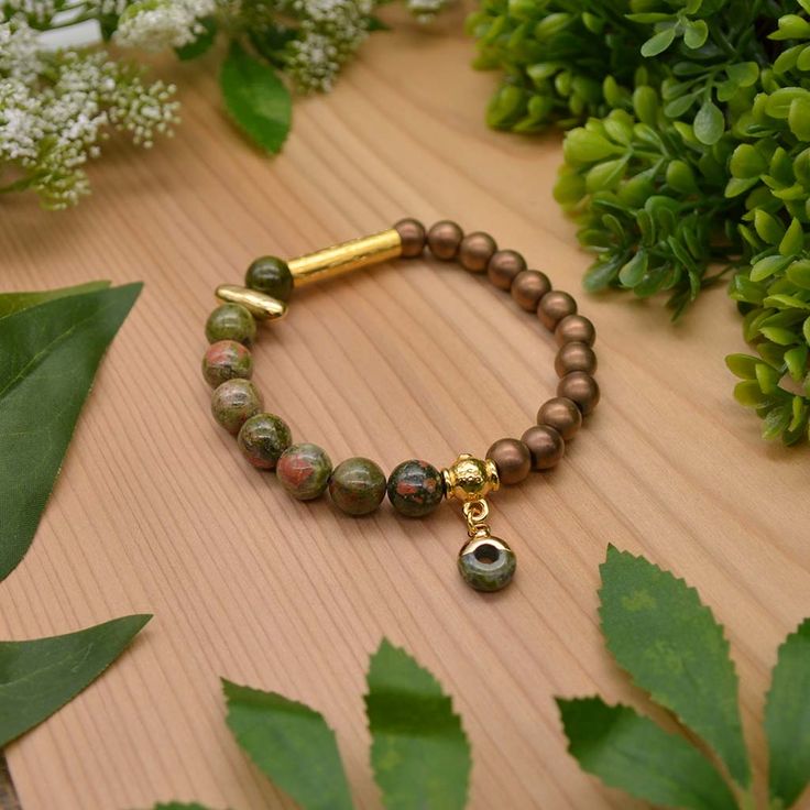 Let mother nature engulf you with warmth and golden light with our new Nature Goddess bracelet. Stand out from the norm with this stunning bracelet that feature earthy unakite gemstones, bronze colored hematite, and striking, goddess-like gold accents. Step into your inner Goddess mode everyday, all day with our new Nature Goddess bracelet. This bracelet is a limited run design so snag one today! Experience a little bit of nature with every Emerald Sun Creations! Buying this as a gift? Tell us w Goddess Bracelet, Nature Goddess, Bracelet Stand, Inner Goddess, Writing Gifts, Golden Light, Crafts Jewelry, Limited Run, Golden Lights