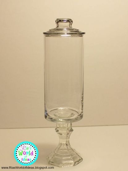 a glass jar on top of a table with the words diy dollar tree apothecary jar